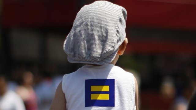 A child wears a Human Rights Campaign logo