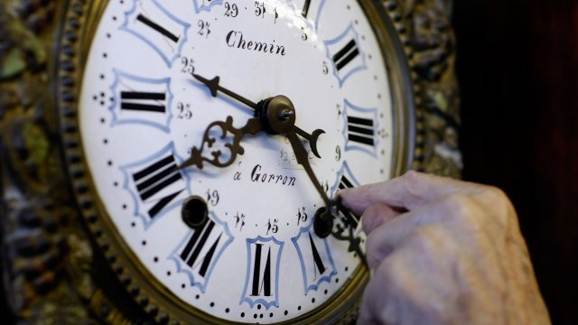 A clock is set back by an hour for daylight saving time