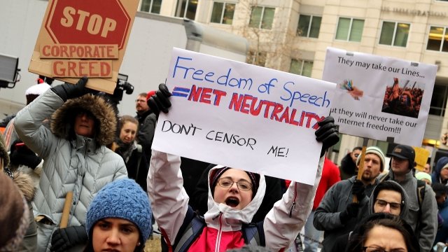 Demonstrators protest the repeal of net neutrality rules