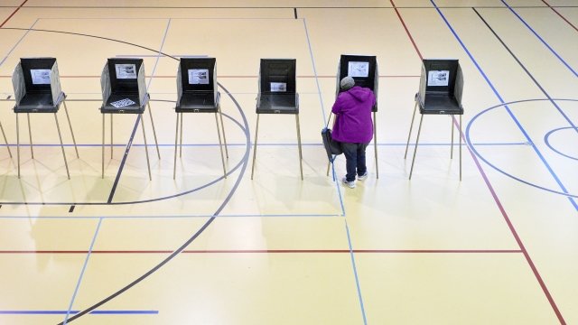 A woman casts her ballot at a voting booth in North Carolina