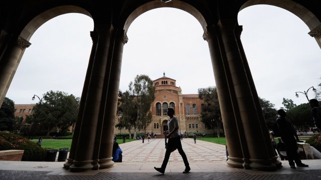A student walks near Royce Hall on the campus of UCLA on April 23, 2012 in Los Angeles, California.