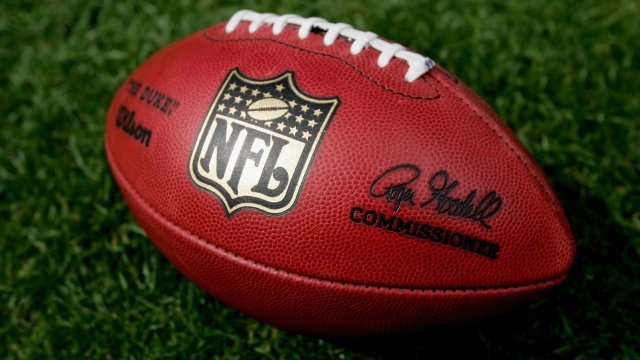 A close up of the official NFL 'The Duke' game ball.