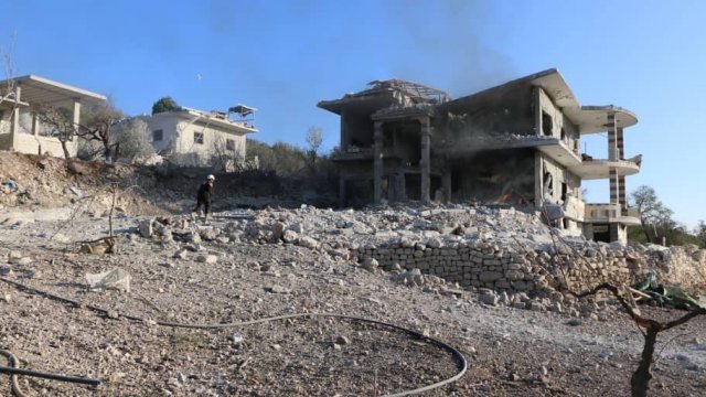 Civil defense volunteers respond to an airstrike in Syria's Idlib province