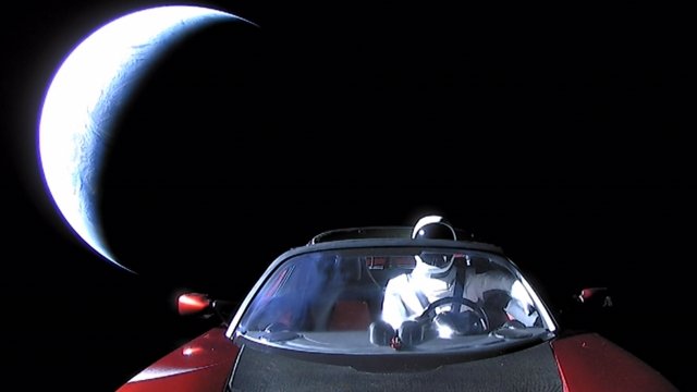 A Tesla roadster with a dummy driver named Starman floats in space