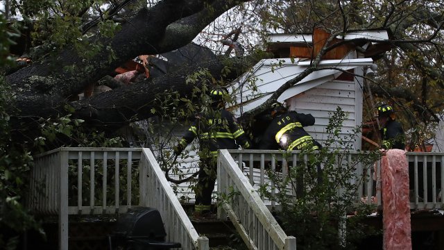 Firefighters look into a home after Hurricane Florence hit the area.