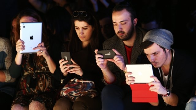 People looking at phones