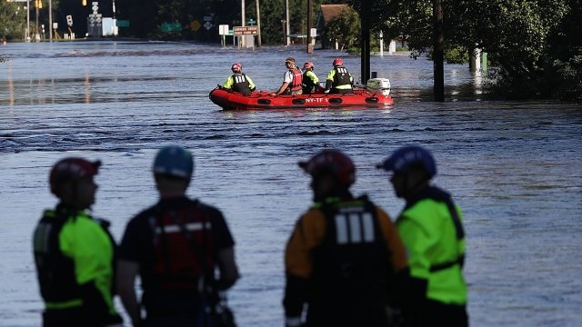 Rescue workers stand in floodwaters in North Carolina