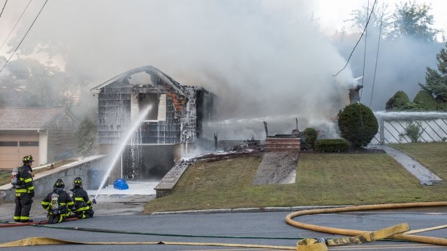Firefighters try to stop blaze in Massachusetts house after gas fire