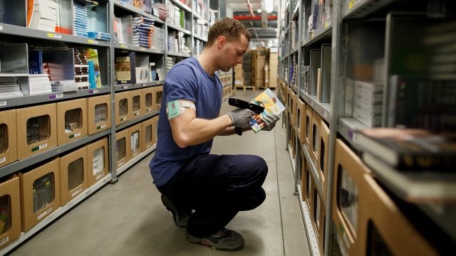 Man scans items in a warehouse