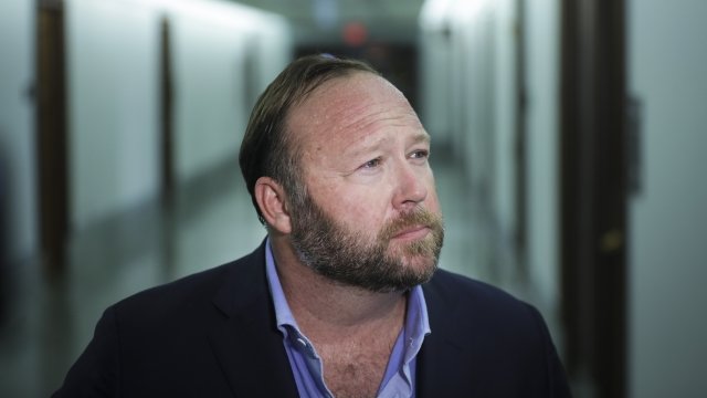 Far-right conspiracy theorist Alex Jones of InfoWars stands outside of a Senate hearing on social media