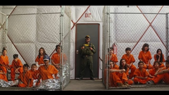 A still image from The Black Eyed Peas' music video for "Big Love," showing migrant children in detention.