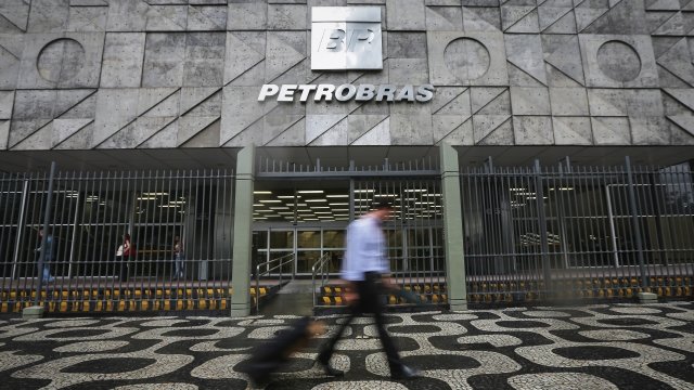 Man walking past Petrobras building