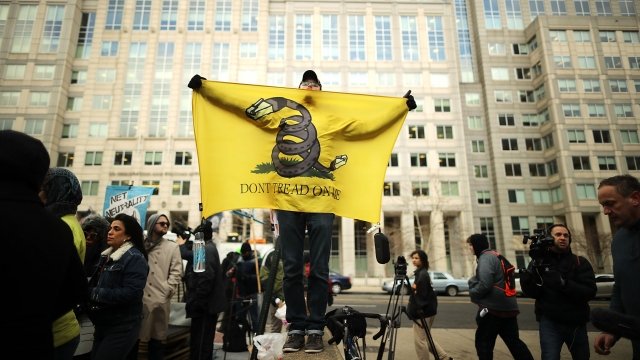 Demonstrators rally outside the Federal Communication Commission building