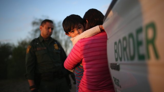 Border patrol questions a migrant mother