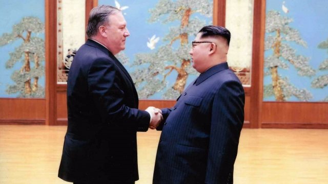 U.S. Secretary of State Mike Pompeo shaking hands with North Korean leader Kim Jong-un
