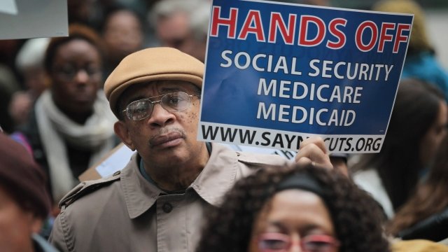 Man protests cuts to benefit programs