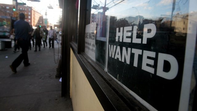 A 'Help Wanted' sign is posted in the window of a New York City business in 2010