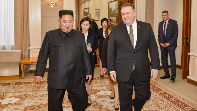 Kim Jong-un and Mike Pompeo