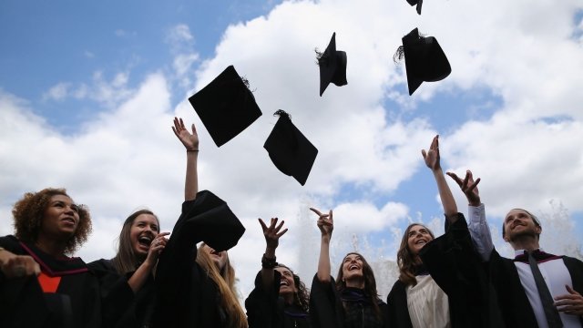 College graduates toss caps