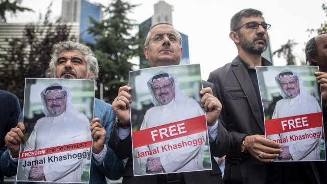 People hold posters of Saudi journalist Jamal Khashoggi