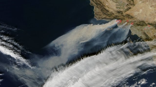 The Santa Ana winds blow wildfire smoke out of California into the Pacific Ocean