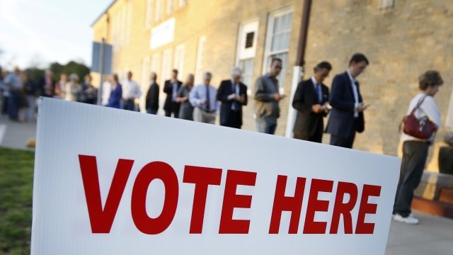 Voters line up outside of a Texas polling location on Super Tuesday in 2016