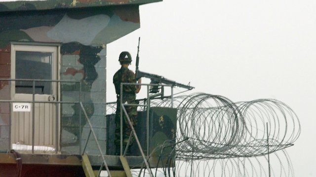 South Korean soldiers stand guard at a post along the border with North Korea