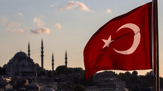 Turkey flag in front of Istanbul skyline