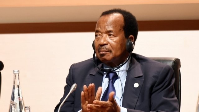 Cameroon's President Paul Biya listens while attending the One Planet Summit.