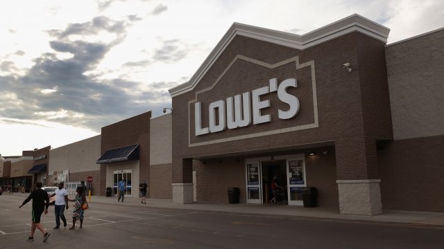 Customers walk out of a Lowes home improvement store