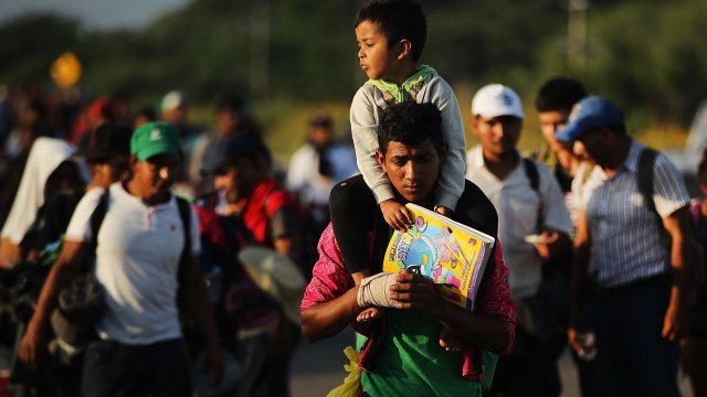 Members of the Central American caravan head out at dawn for their next destination on November 01, 2018.