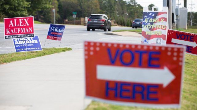 Voting signs in front of a polling location