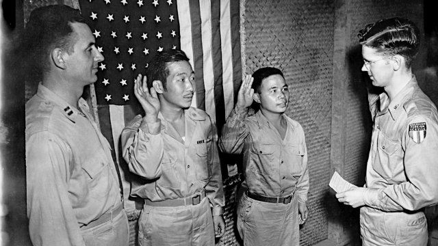 (1944) Pvt. Moy Doo Pon and Pvt. Lee Ben Hong of the 446th Engineer Company are sworn in for citizenship.
