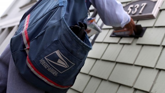 A U.S. Postal Service letter carrier.