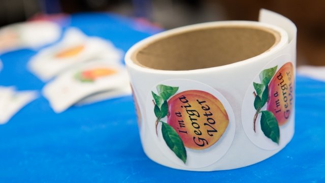 Roll of Georgia voter stickers.