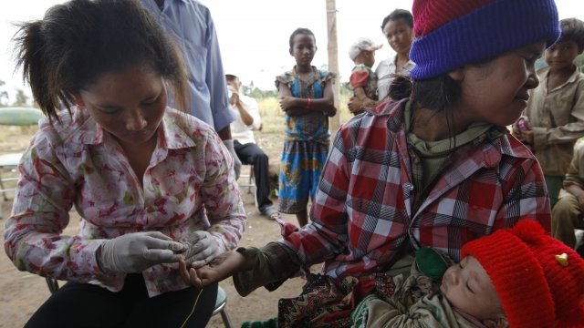 A woman gets tested for Malaria