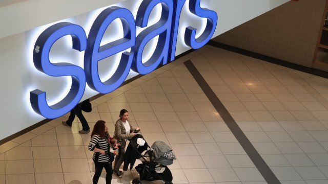 People shop at a Sears store.