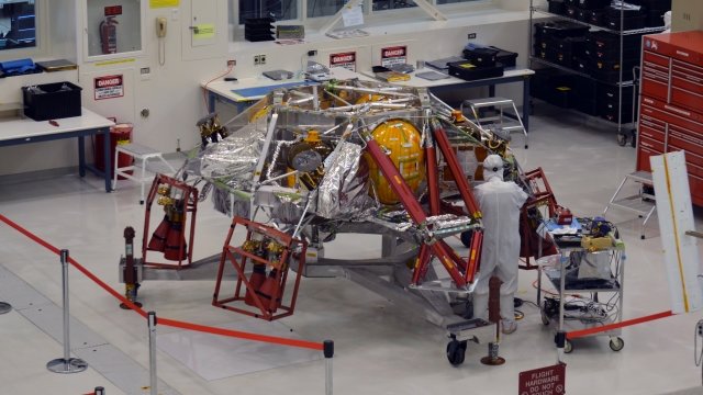 Technician works on Mars 2020 rover.