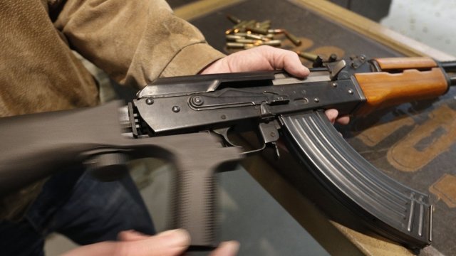 A bump stock installed on an AK-47