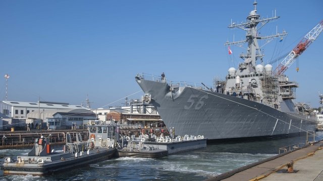 The USS John S. McCain leaves dry dock in Japan
