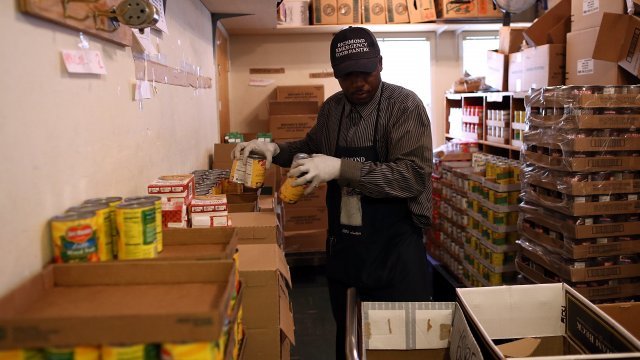 Man works in a food bank.