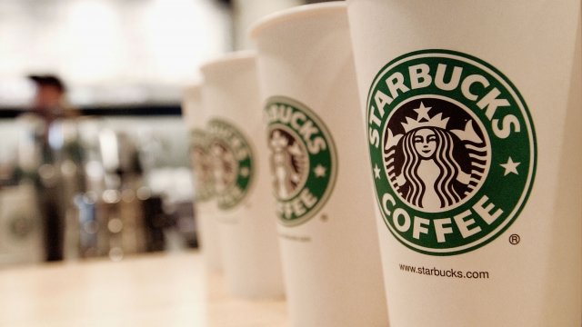 Beverage cups featuring the logo of Starbucks Coffee