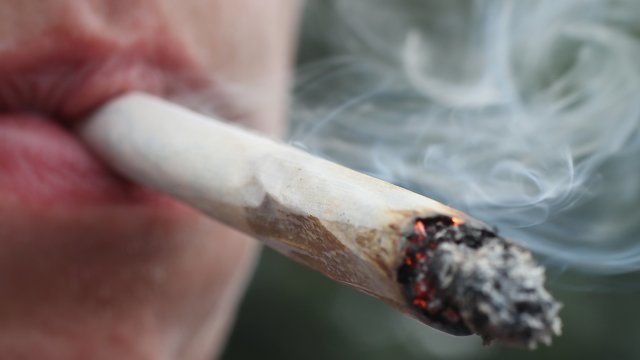 Closeup of man smoking a joint.