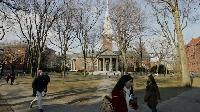 Students walking across Harvard's campus
