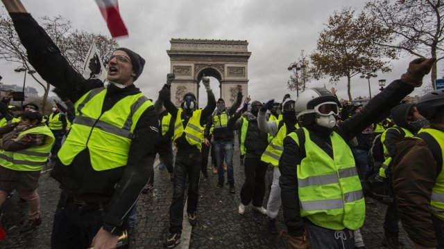 Protesters yell during a "yellow vest" demonstration