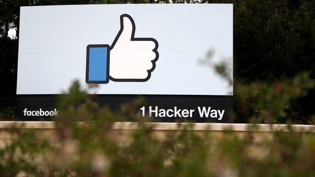The Facebook logo appears on a sign outside company headquarters