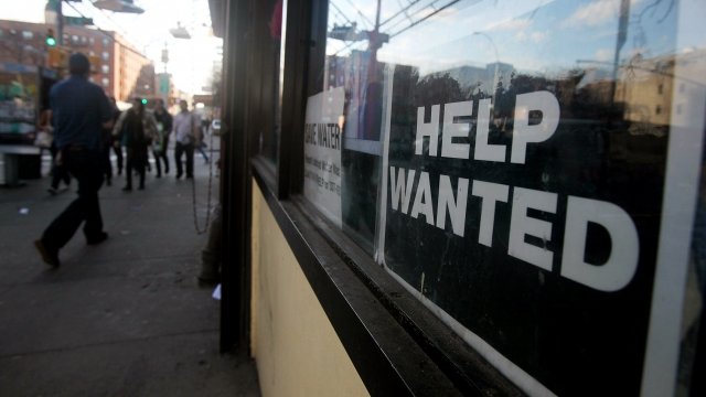 'Help Wanted' sign in window