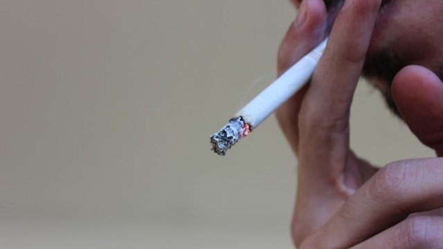 A man smoking a Marlboro cigerette