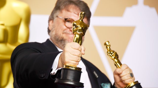 Guillermo Del Toro holds Oscars