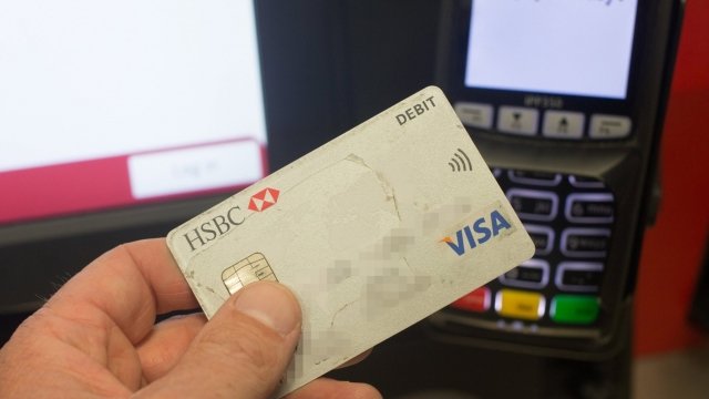 Person uses a debit card